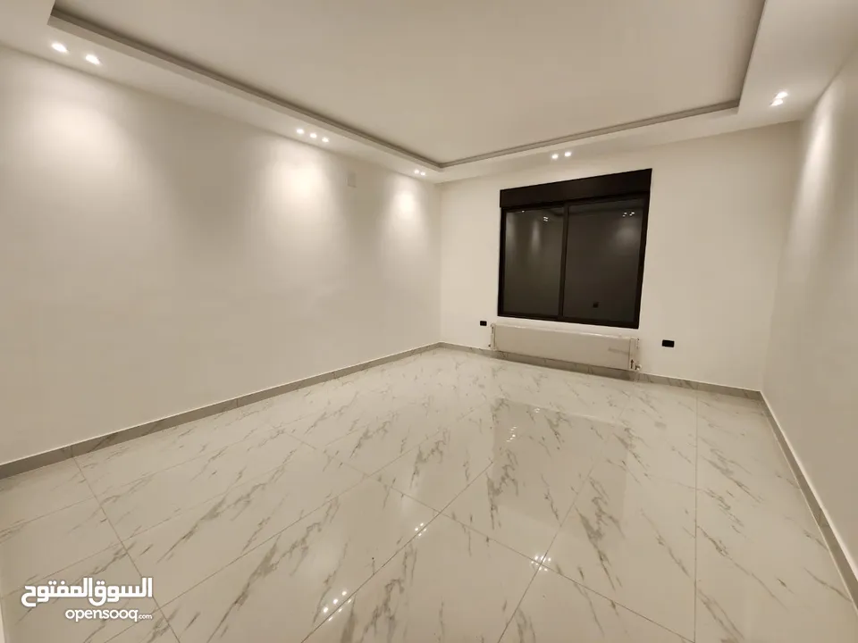 شقة مع روف دوبلكس للبيع على طريق المطار ( البنيات )  ref : 14367
