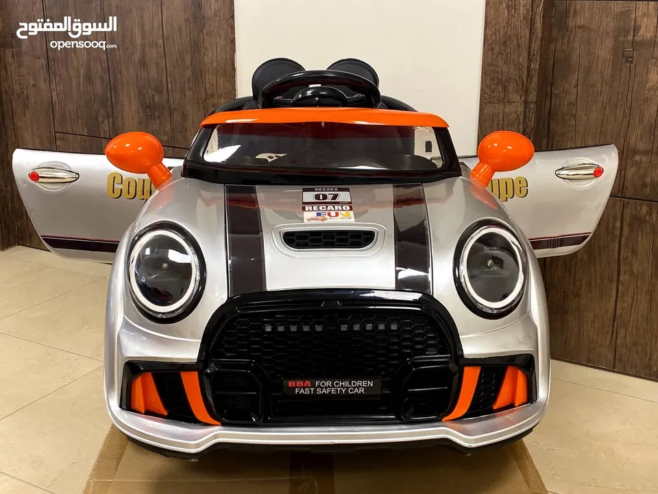 سيارة أطفال 3 ماتورات بتصميم  سيارة Mini Cooper للشارع والبيت من سنتين ل 5سنوات