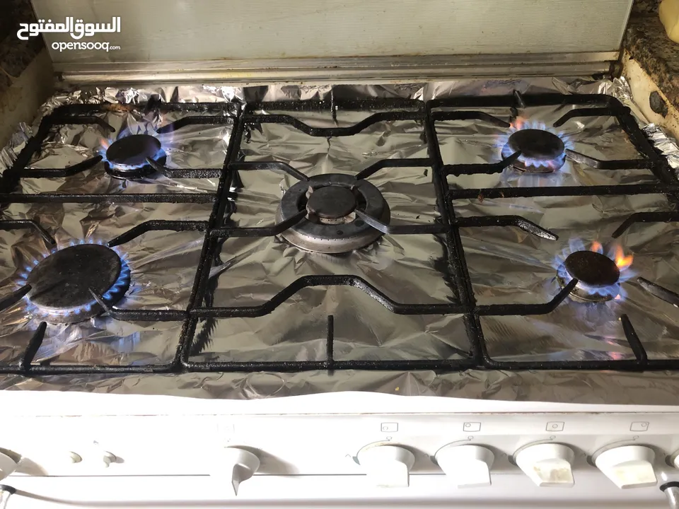 Cooking range with 5 burners and oven with conventional fan and other Accessories like tray etc