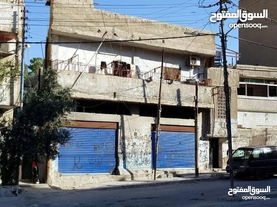 ارض تجاري مع طابقين مع مخزنين-الزرقاء-الجبل الابيض (كلو مفروز) قوشان مستقل-كاش فقط لا يتوفر تقسيط...