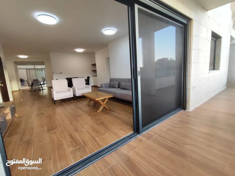 شقة جديدة مفروشة مع حديقة خاصة للإيجار – عين منجد  شارع إسكان المهندسين