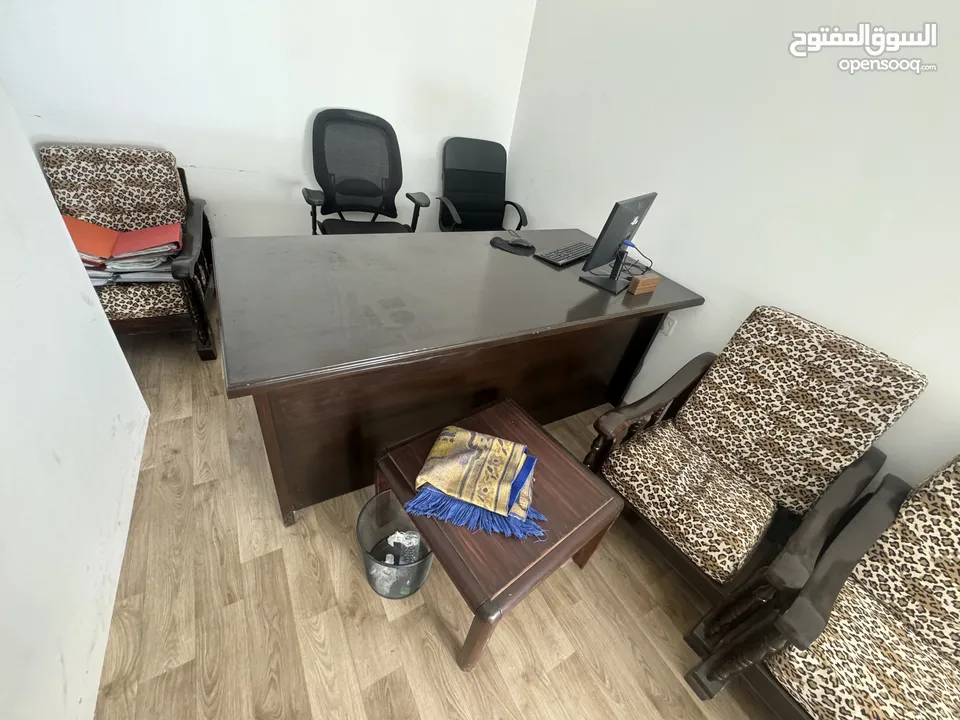 2 office table with one chair and sofa