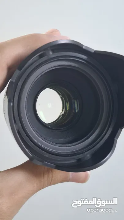 عدسة كانون 75-300 وعدسة كانون yongnuo 50 فتحة 1.8 اسعار + 2 هود فتحة 52. الاسعار فيها مجال