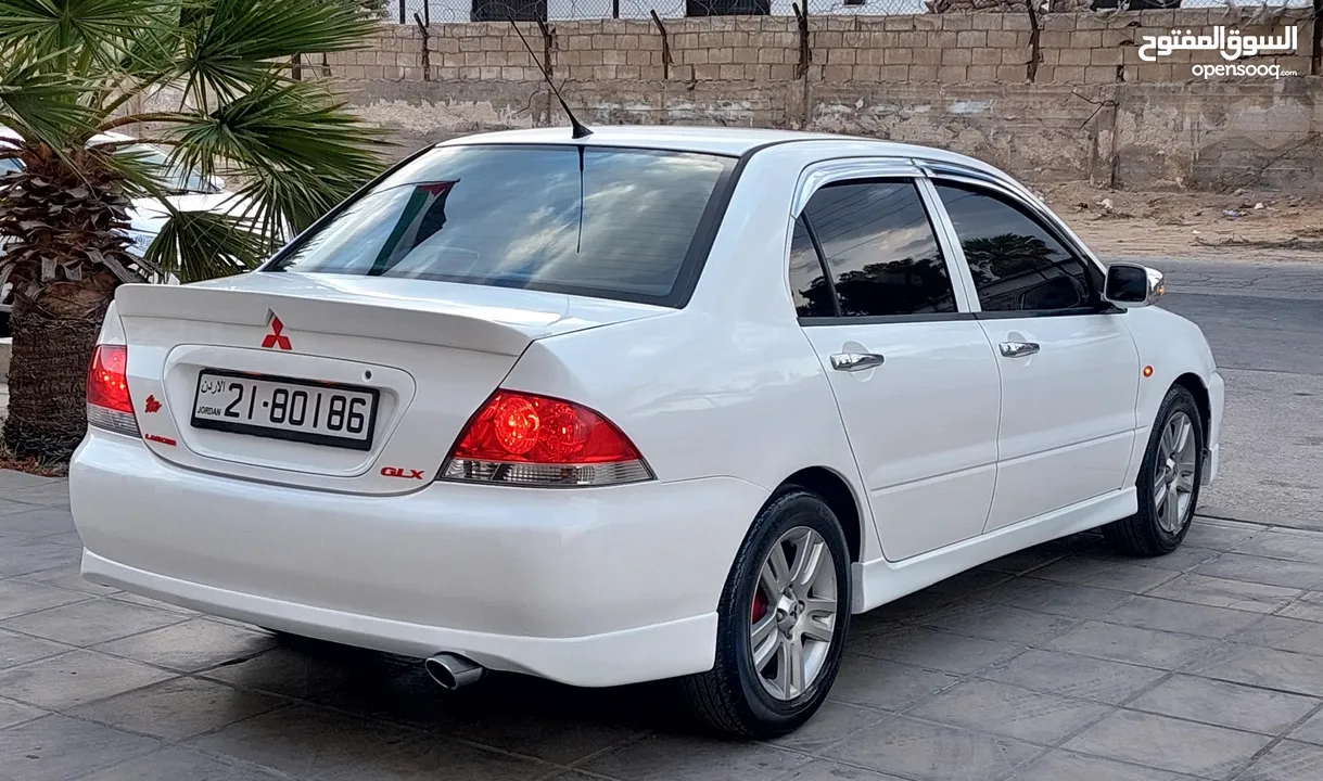 ميتسوبيشي لانسر GLX مميزة موديل 2011  السيارة بحالة الوكالة وشركة.