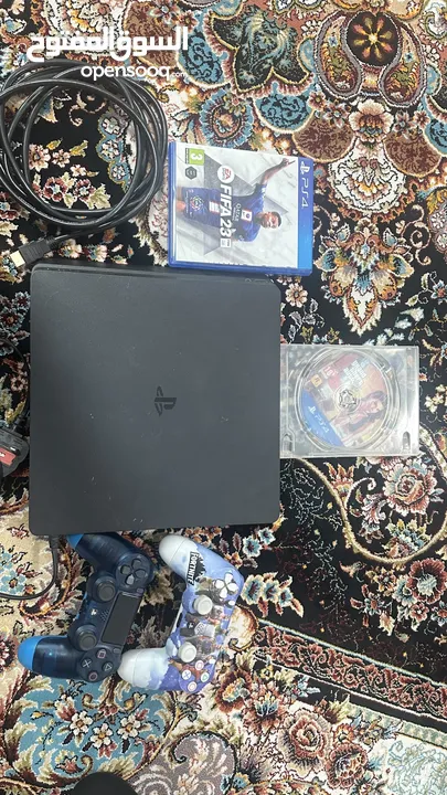 Ps4 Slim with two controllers and a fifa23,gta 5 discs in good condition