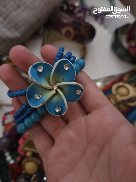 أساور خشب وواحدة حديد (بني أزرق ملون)