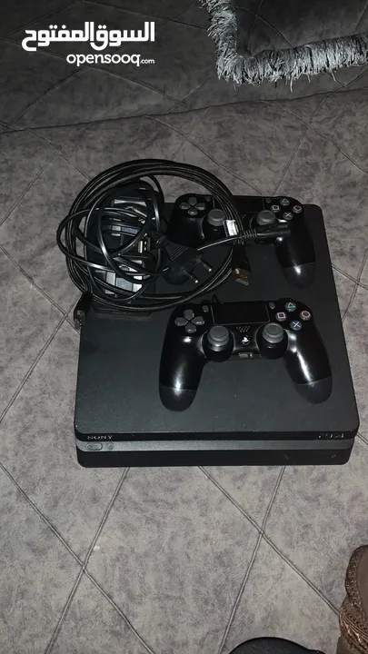 جهاز ps4 slim 500gb مع يدتين وشاحن لليدات ولعبتين فيفا 24 gta5
