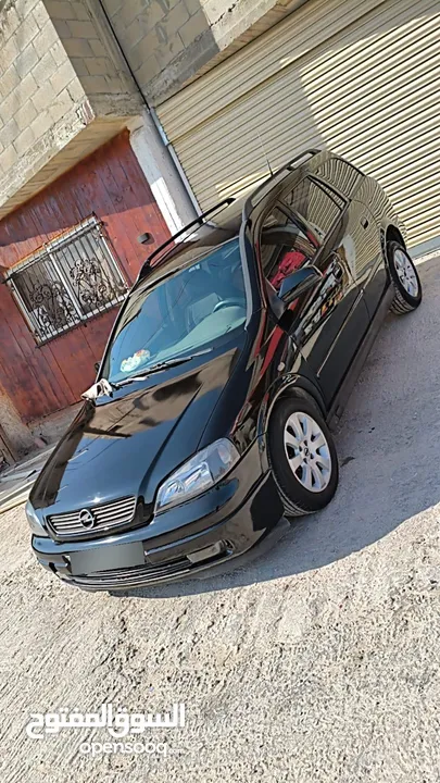 أوبل استرا ستيشن 99 اتماتيك بنزين متور 1600 ضبل فحص ممتاز ترخيص تامين