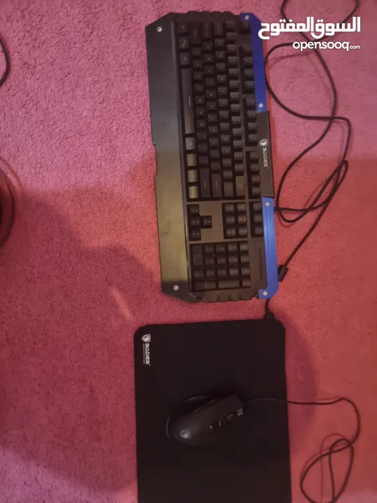 keyboard and mouse and 2 headsets