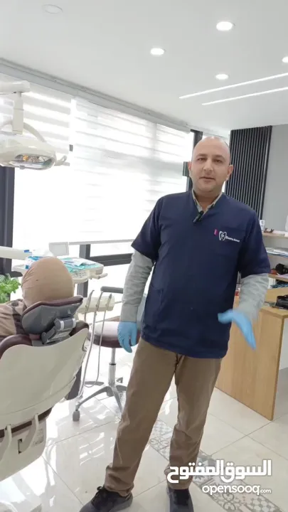 علاج أسنان مميز في جنين مركز د. اسامة عواد -برج الساعة ط4