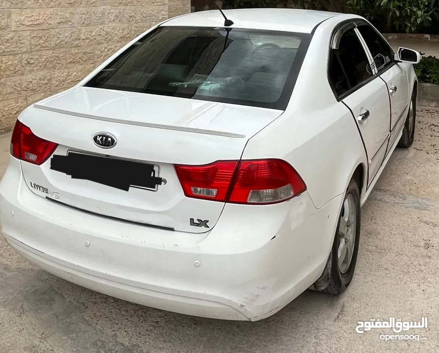 كيا لوتزي 2009 تب ترنك كيا لوتسي اوبتما لون ابيض