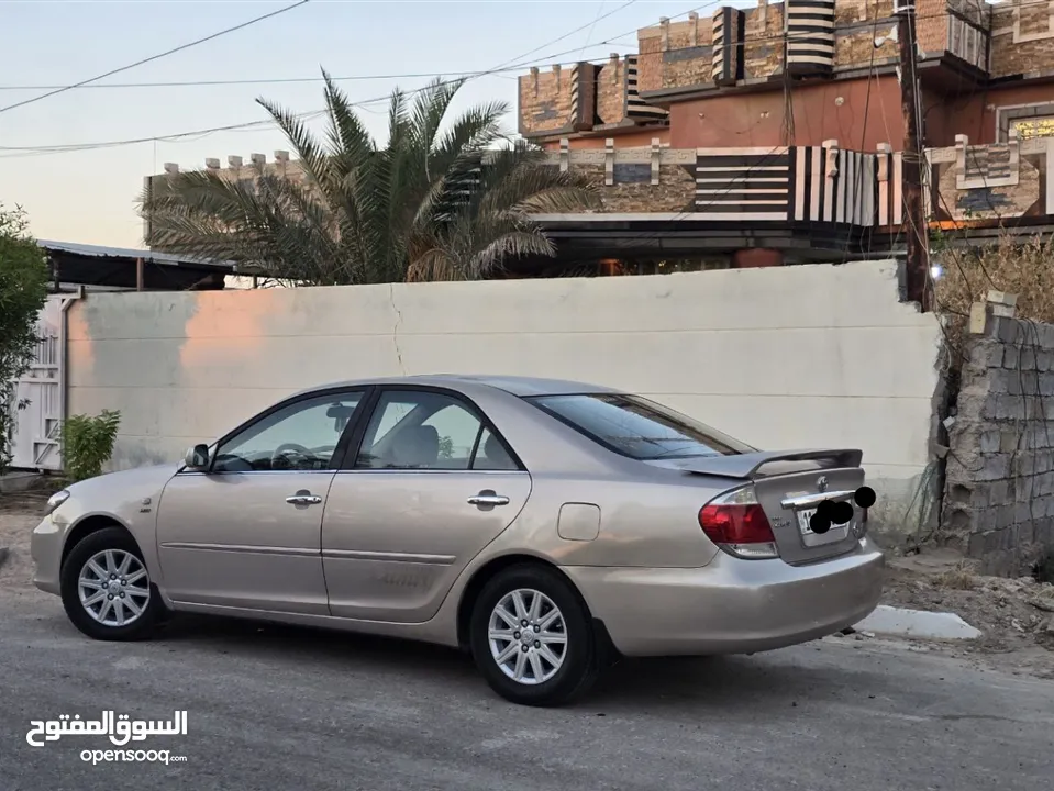 كامري 2006 خليجي  اربعه سلندر بيها قطعتين ابيع حزام رقم بغداد دولي تحويل مباشر باسمي السياره