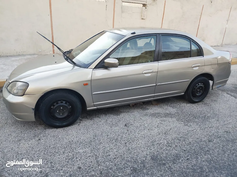 هوندا سيفيك لون ذهبي موديل 2003 جير عادي  إقتصادية جدا تقطع بالتنكة 280 كيلو بور ستيرنح سنتر لوك