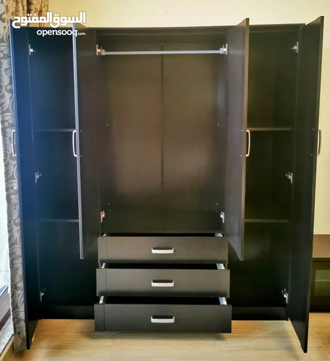 Four door wardrobe, excellent condition and quality.