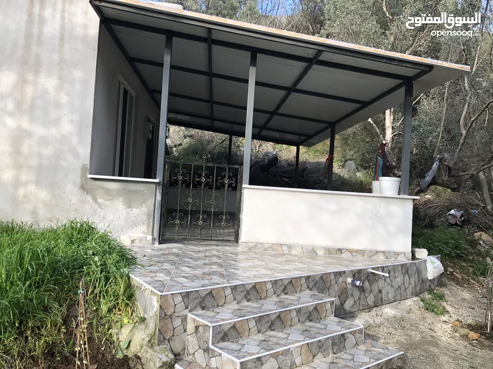 Town House with stunning view at the seaside in a garden with olive trees