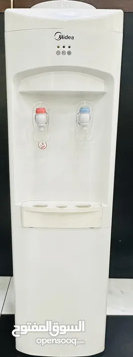 Water cooler and microwave for  sale like a brand new condition both of 50bd with delivery