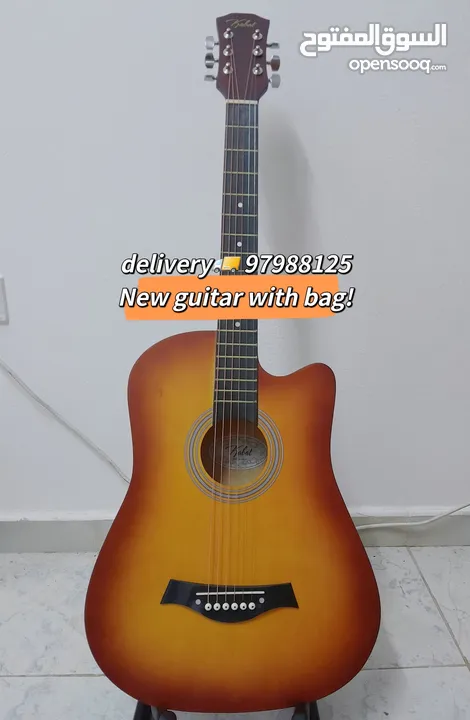 New acoustic guitar, with bag and picks, delivery