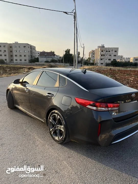 كيا K5 هايبرد موديل ال 2018 لون فيراني ميتالك  فحص اربعة جيد ولا ملاحظة فل كامل عدا الفتحة - كاش