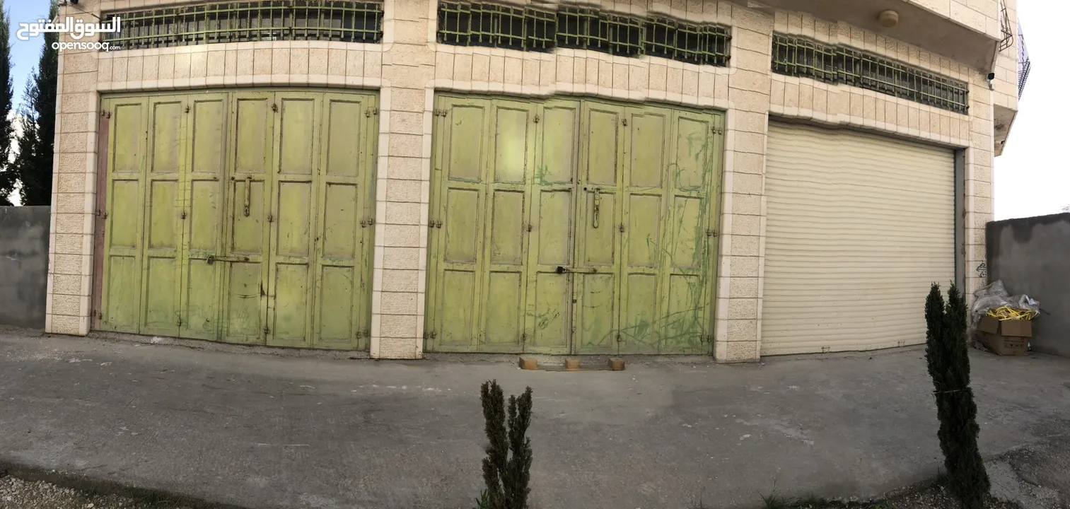 محلات تجارية للإيجار كمخزن بضائع قرب شارع سنجر دورا الخليل– مساحة 120م2 بثلاثة أبواب
