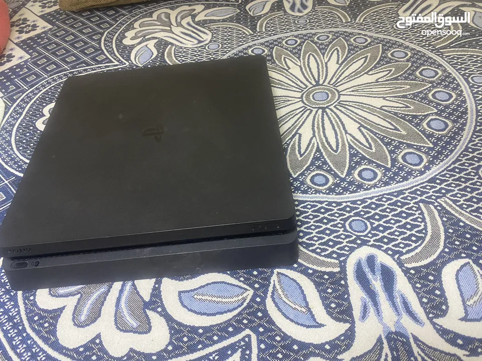 PS4 slim with 2 controllers and 5 games with box