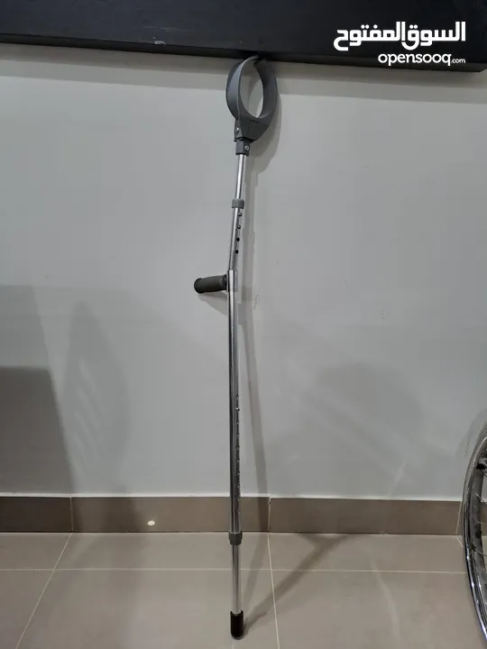 Wheelchair, Walk stick under arm, Walking aid كرسي طبي، عكازات