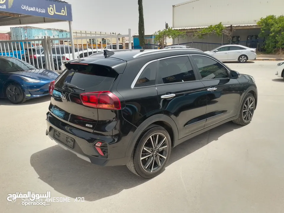 كيا نيرو هايبرد 2021 فحص 7جيد لون اسود مميزه للبيع مجمرك أو بدون جمرك للإعفاءات من المستورد مباشره