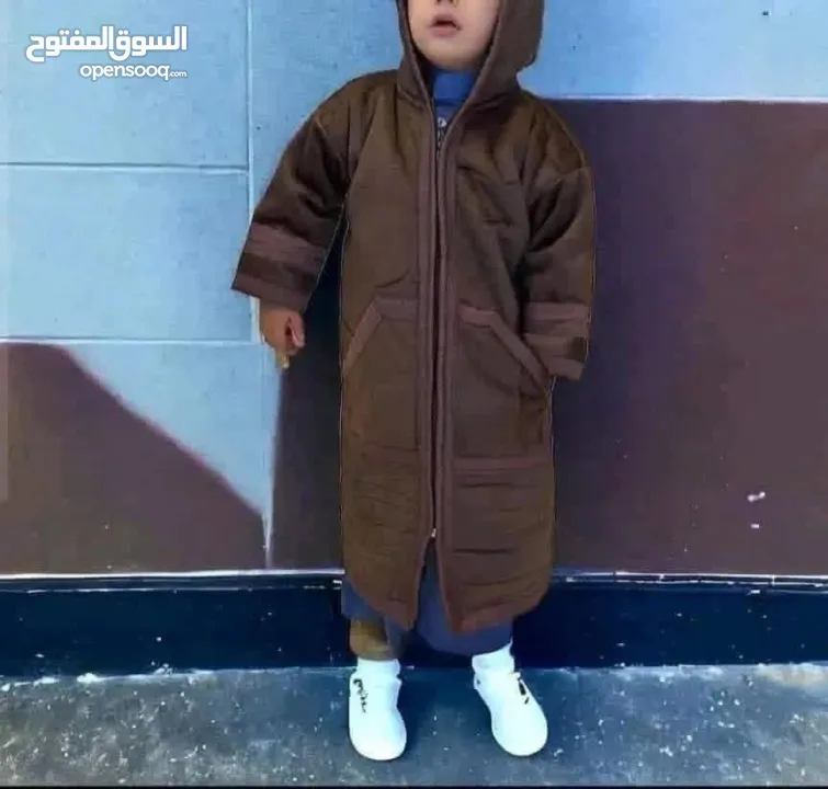 فروة شتوية للأطفال بقبعة مدمجة دفء مثالي وأناقة تناسب كل الأوقات معطف عملي بتصميم أنيق يوفر الدفئ