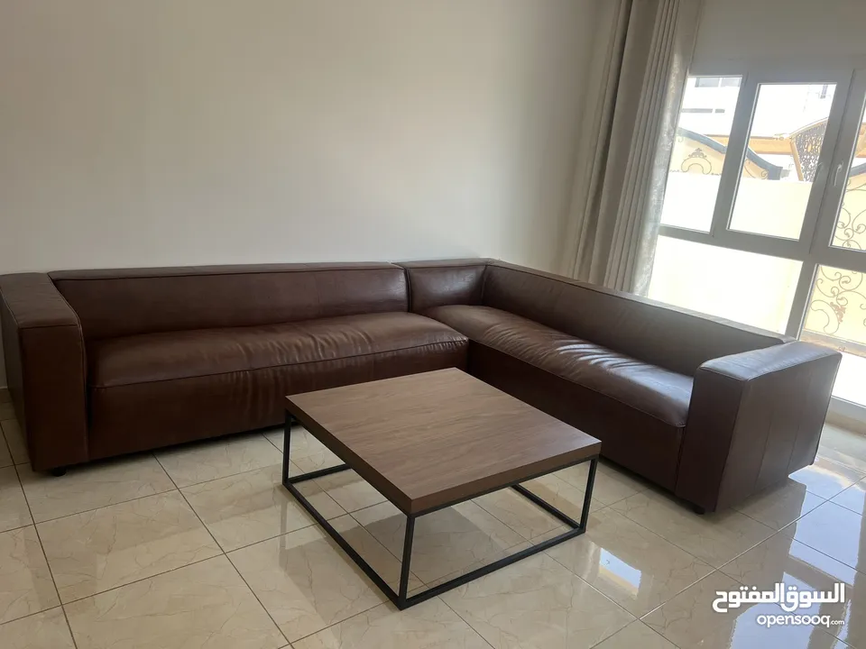 Leather L-shaped sofa and coffee table