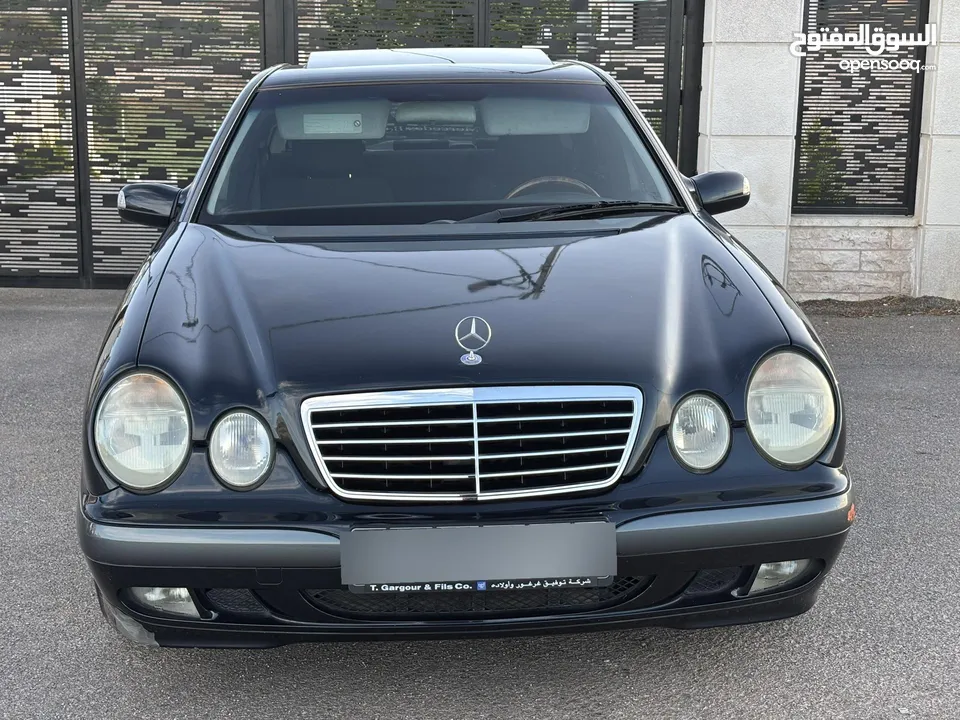 E200. 2002  قرش ونص 2002  رقم الهاتف بالوصف