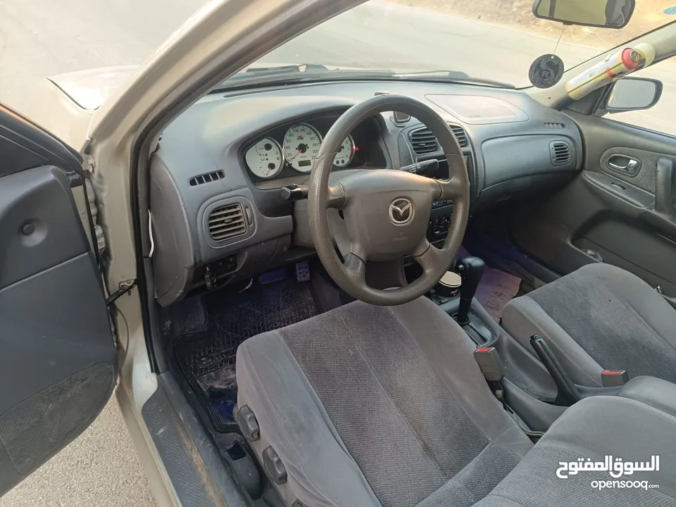 مازدا 323 اتماتك فتحه اصليه تحفه بمعنا الكلمه بسعر حرق 29500 ألف نقدا بدل وارد فحص نخب