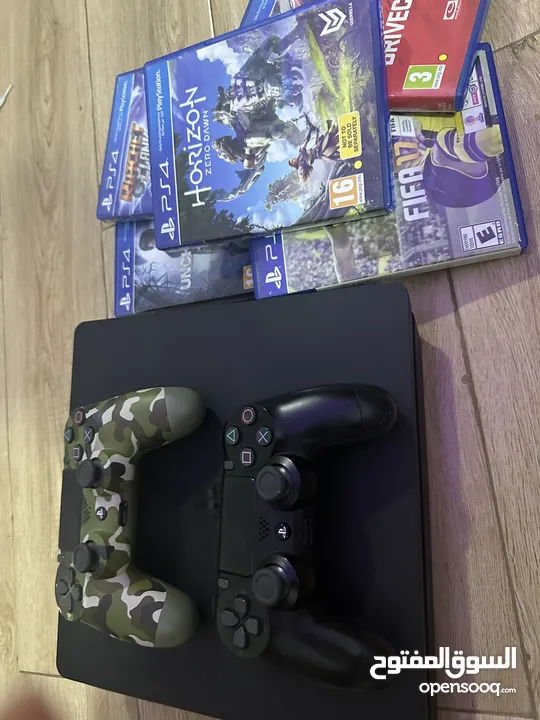 PlayStation 4 with 2 controllers and 5 games