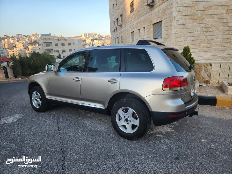 VOLKSWAGEN TOUAREG 2004 فل اوبشن كامله الإضافات مع فتحه وجلد كراسي كهربه مدفيه حامي بارد فحص كامل