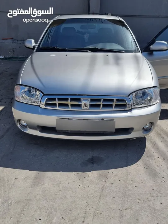 كيا سبيكترا 2001 بسعر 2400 جير عادي سياره نظيفه جدا  kia spectra 2001