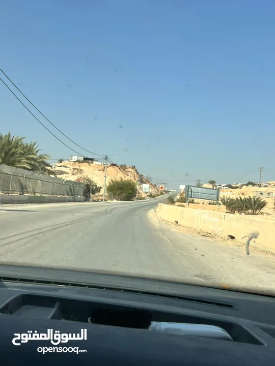 ارض للبيع في دير ابزيع  تيجاري ع شارع فرعي