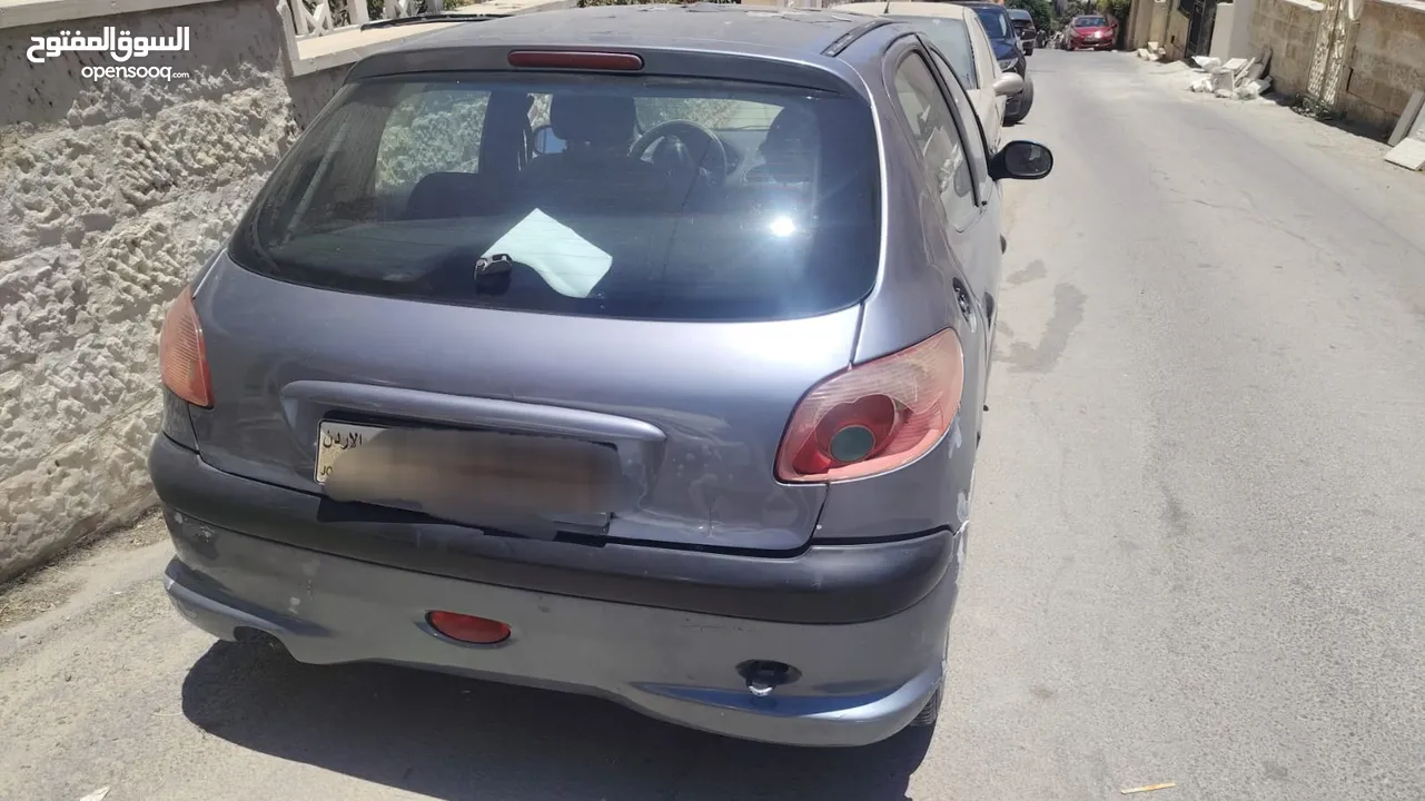 بيجو 2007 موديل 206 فحص كوم حديد 1300دينار