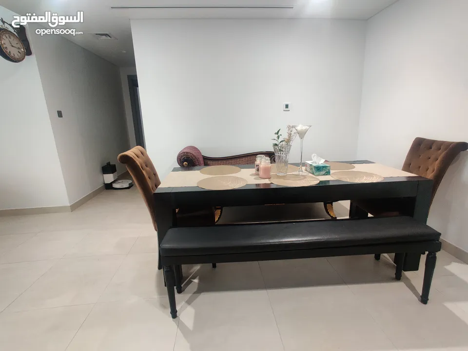 Dining table (The ONE), benches, chairs (Marina) for AED 800.