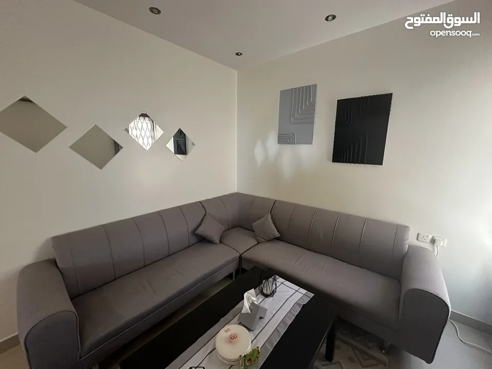 كنبة شكل ل - Grey L-shape Sofa