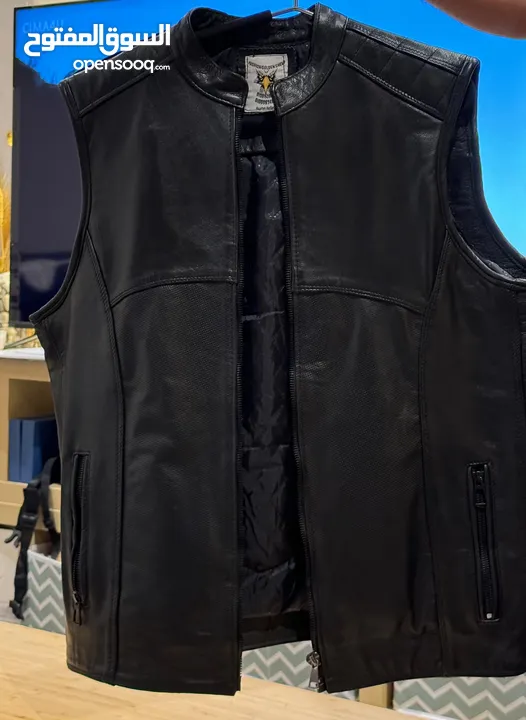 Original leather Biker’s vest and various helmets