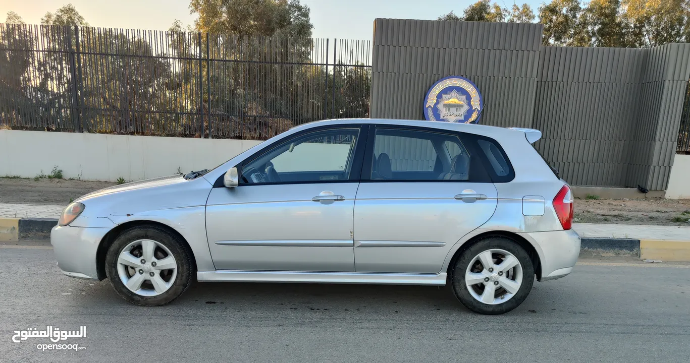 سيارة **KIA Spectra 5 موديل 2009** بحالة **ممتازة** وبدون أي عيوب