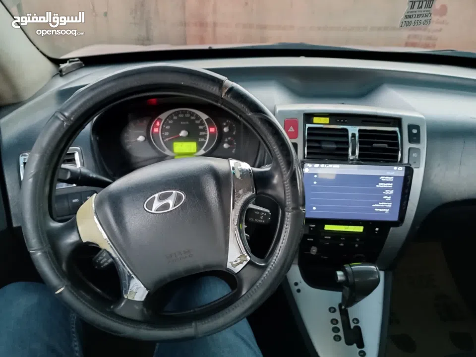 جيب هونداي توسان موديل 2007 ماطور 2000 لون خمري كام لا ينقصه شيئ