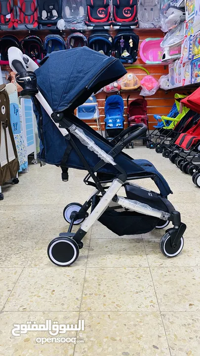 عرباية السفر من island toys ماركة NE الروسية  مع امكانية التحويل ل حقيبة يد للحمل