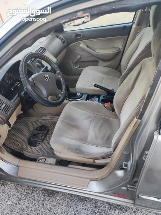 هوندا سيفيك لون ذهبي موديل 2003 جير عادي  إقتصادية جدا تقطع بالتنكة 280 كيلو بور ستيرنح سنتر لوك