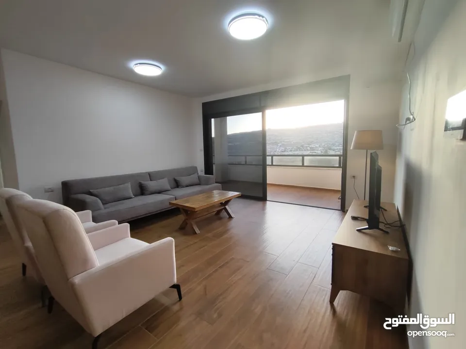 شقة جديدة مفروشة مع حديقة للإيجار – عين منجد  شارع إسكان المهندسين