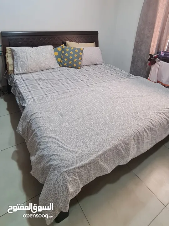 King size bed made from Italian wood brought from the United Arab Emirates.