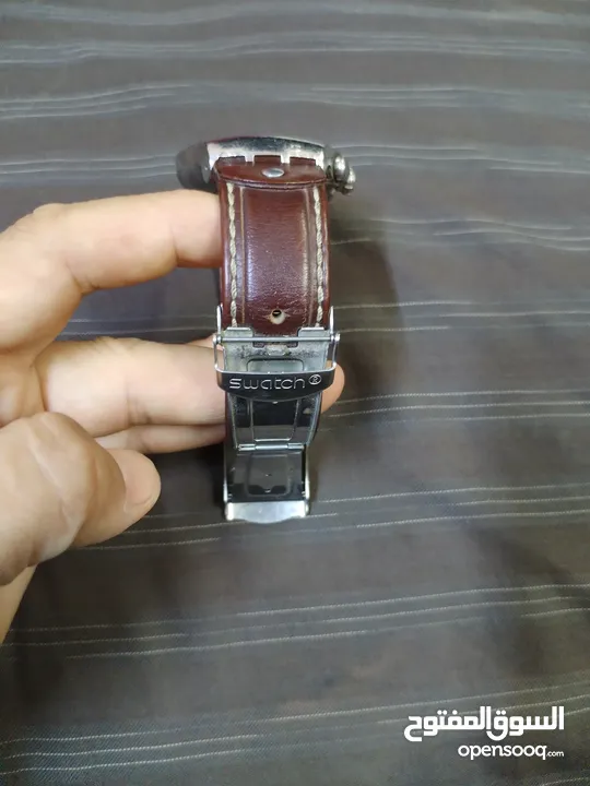 ساعة سواتش بحالة الوكالة أكبر حجم