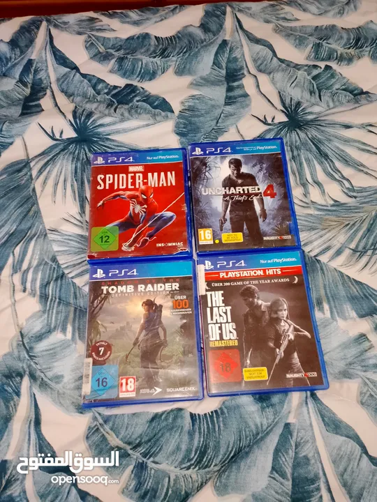 العاب ps4 اربع العاب: uncharted.  the last of us. spiderman. tomb raider