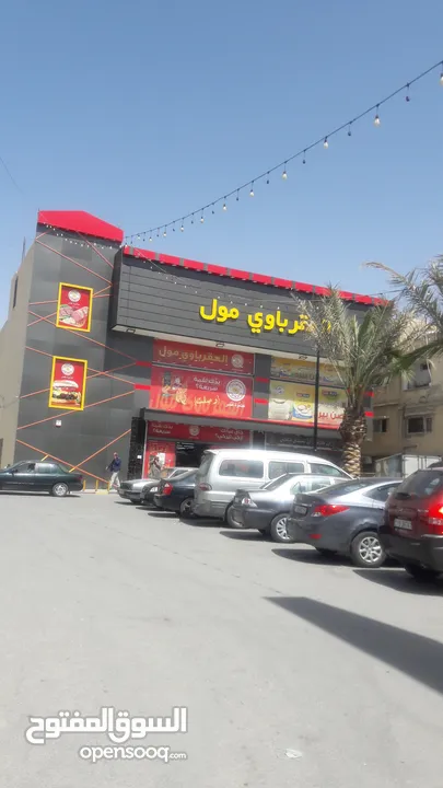 مجمع تجاري للإيجار بدون خلو في موقع مميز في الزرقاء حي معصوم الشارع الرئيسي جوار دوار معصوم