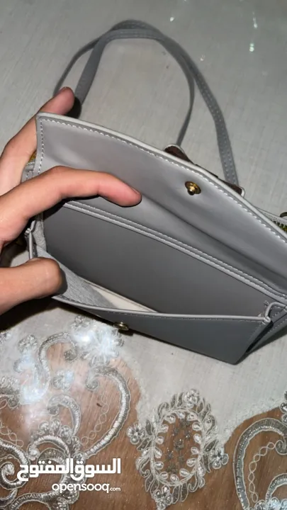 شنطة كتف رمادية