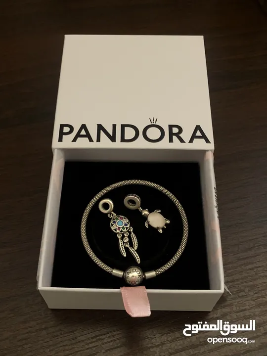 PANDORA bracelet, for sale, plus two charms as a gift. price for all 60 dinars