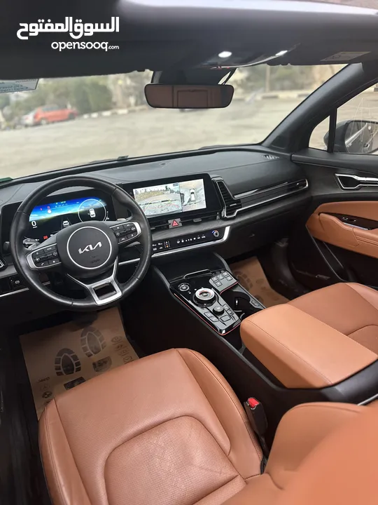 كيا سبورتاج هايبرد 2023 - فل كامل مع بانوراما - غرفة مميزه - عداد قليل اصلي - إمكانية التقسيط.